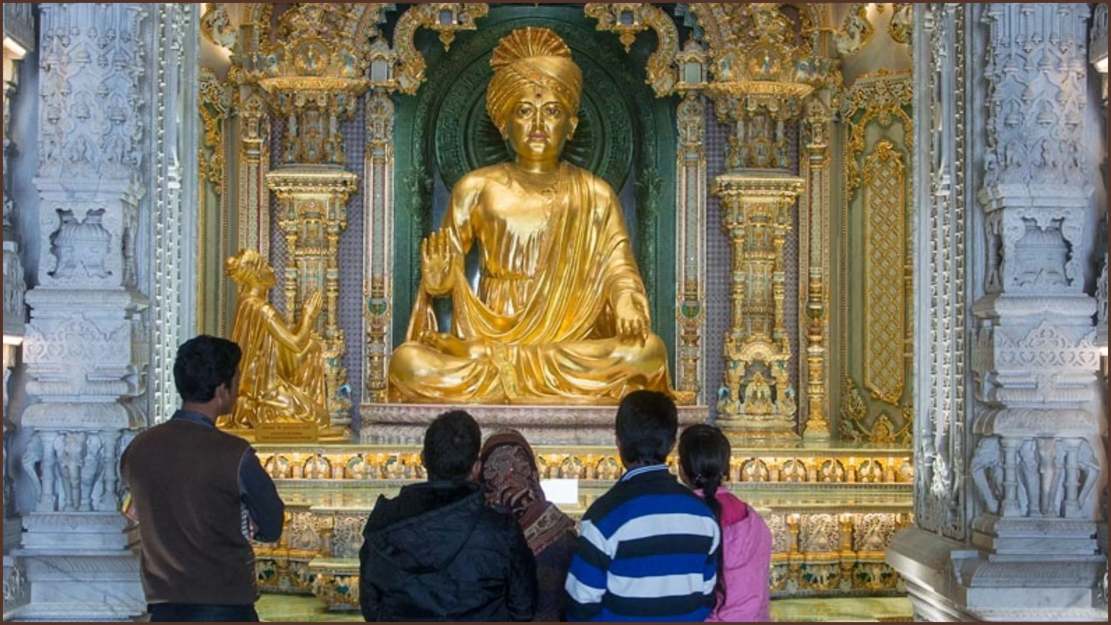 A golden idol of Lord Swami Narayan in the Garbagreh of the temple. 