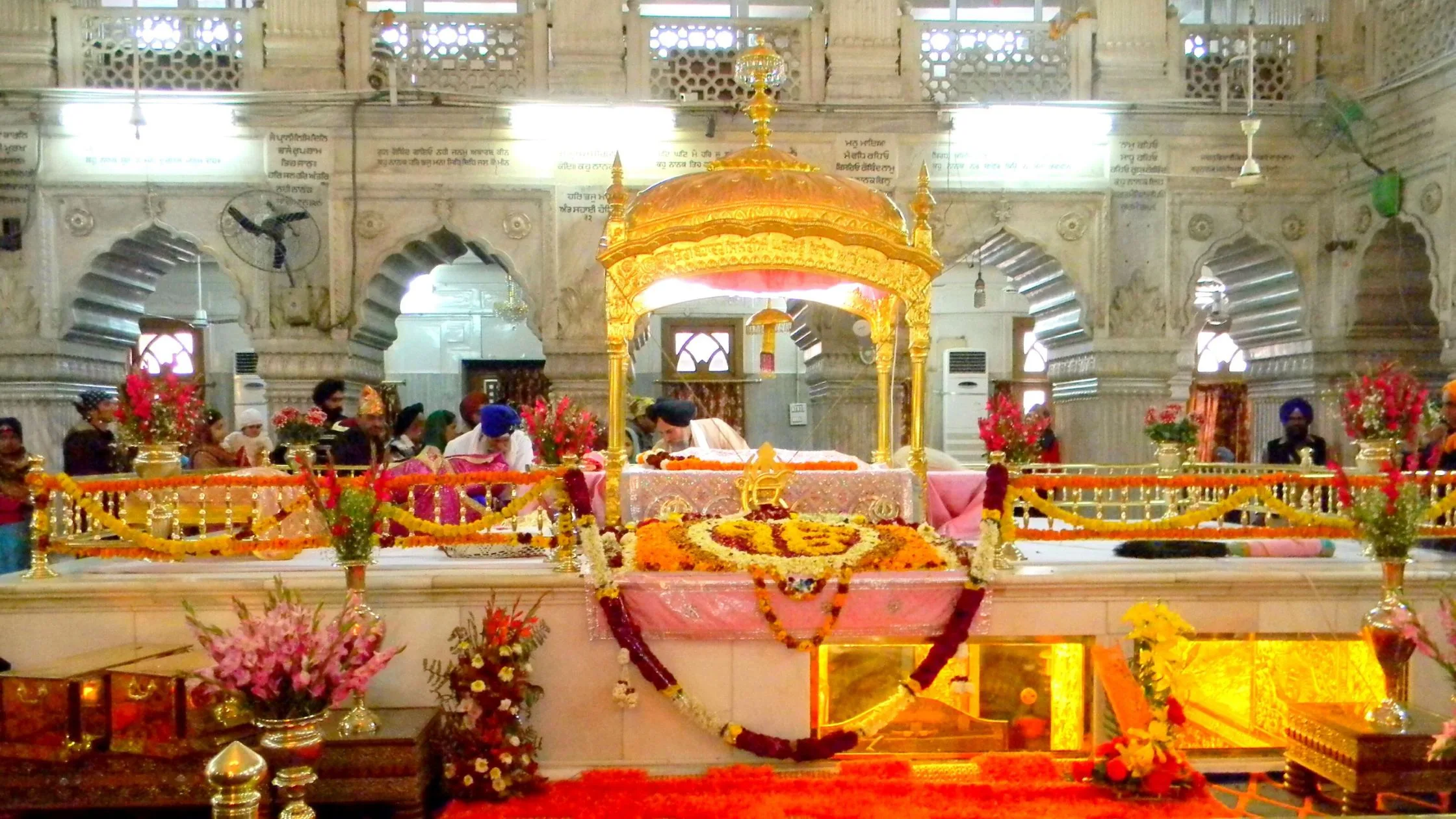 The interior of the Gurudwara with Guru Granth Sahib in the middle. 