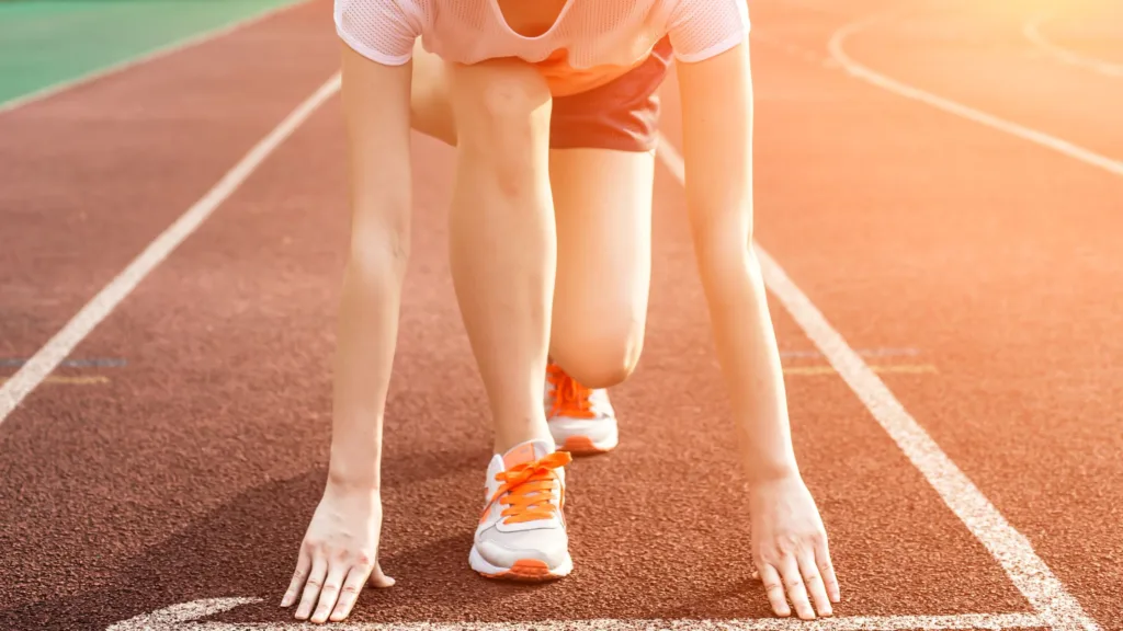 A girl ready for a run on the race track.