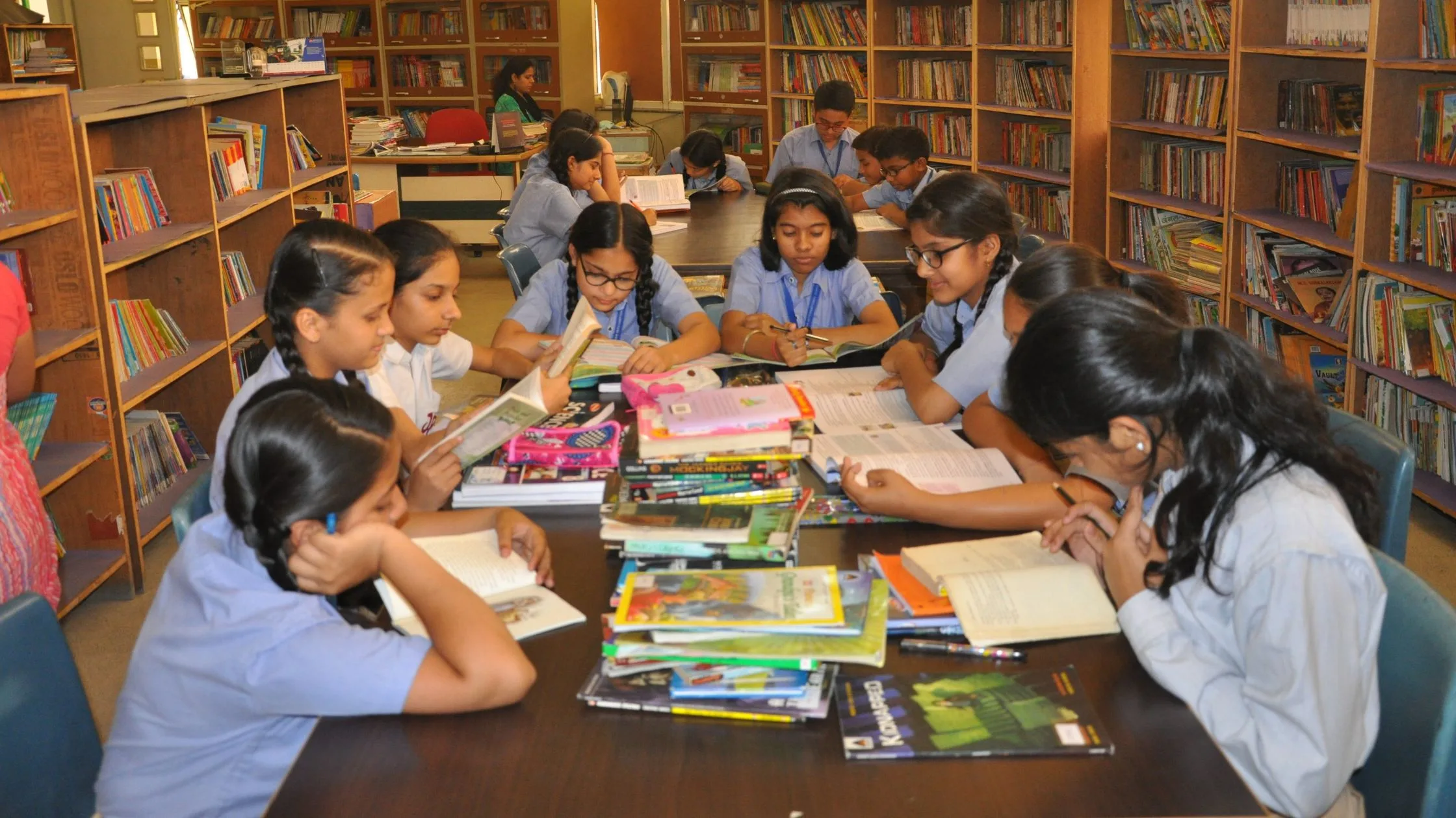 Students at Sam International School sitting in the Library. 