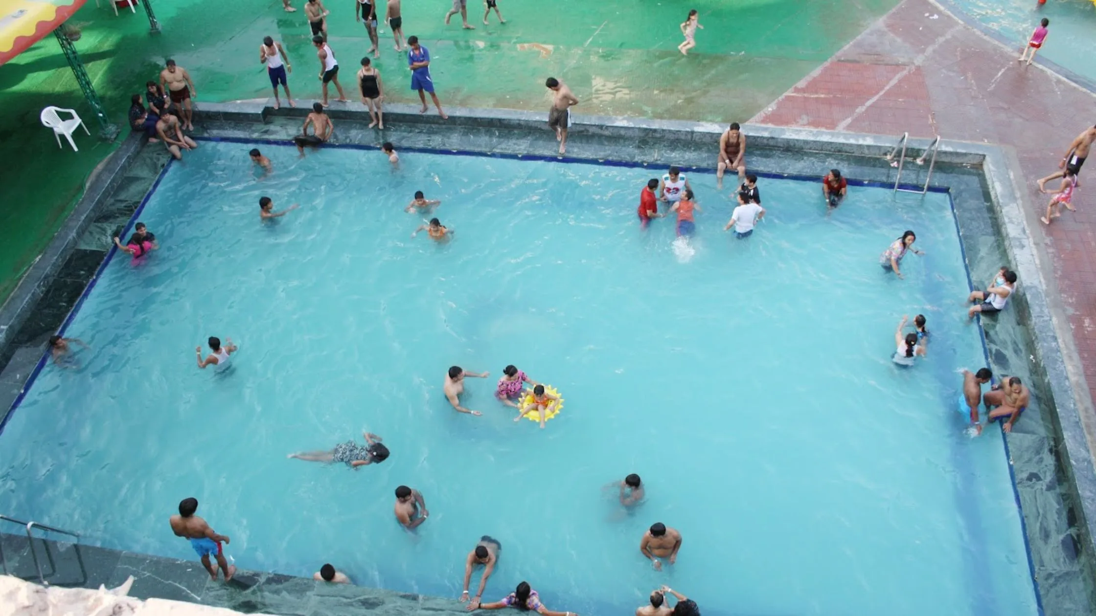 People having fun in the swimming pool. 