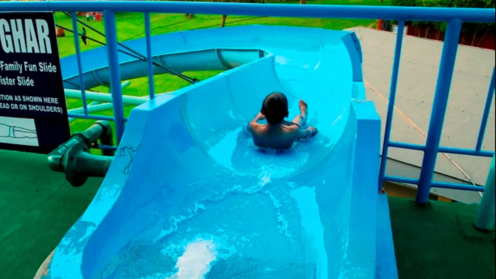  A kid enjoying water slide at AapnoGhar water park