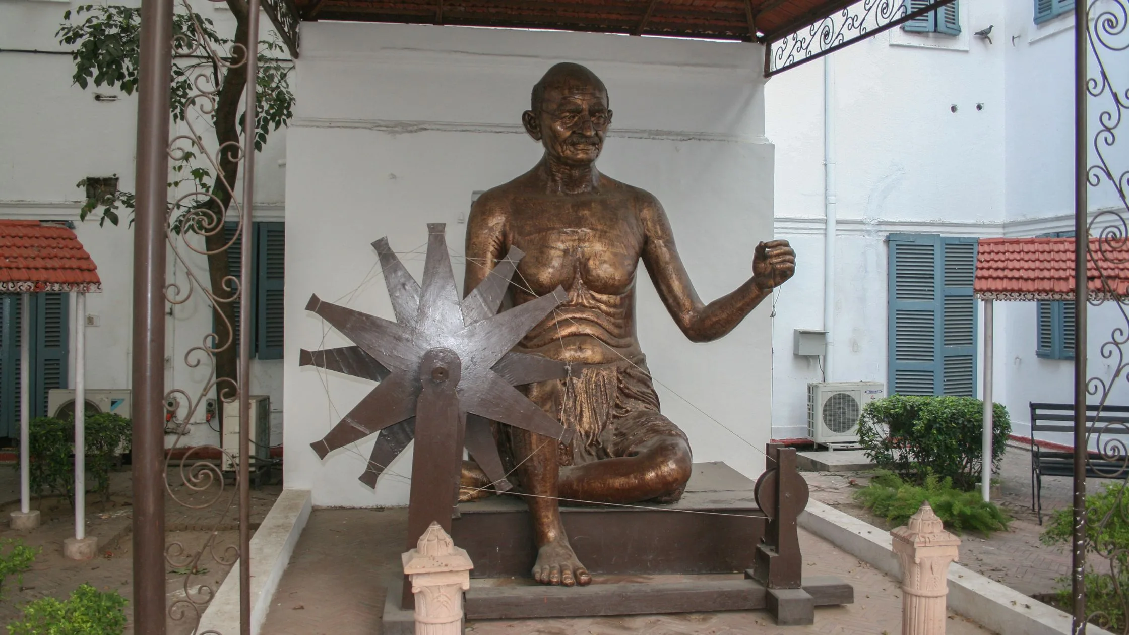 Gandhi statue spinning wheel