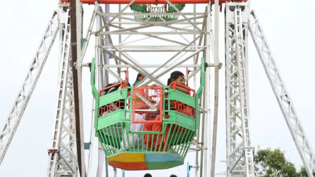 Kids playing at the amusement park with full safety.