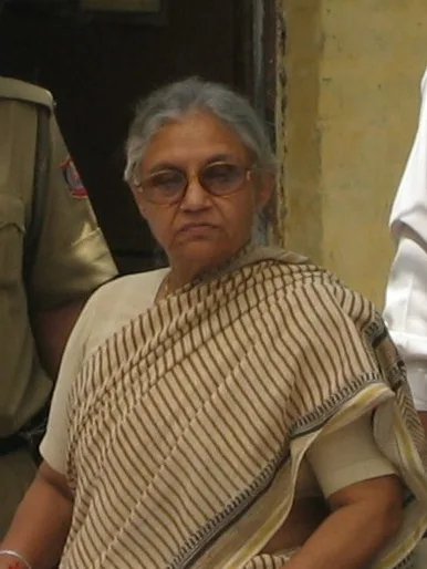 Former CM Sheila Dixit wearing a brown cotton saree.