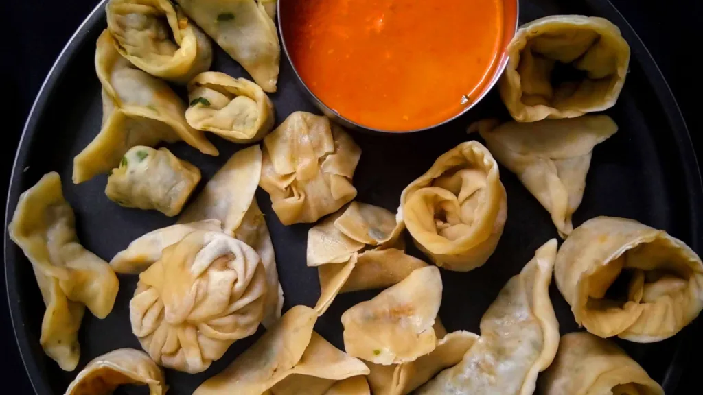 Momos served in a plate.