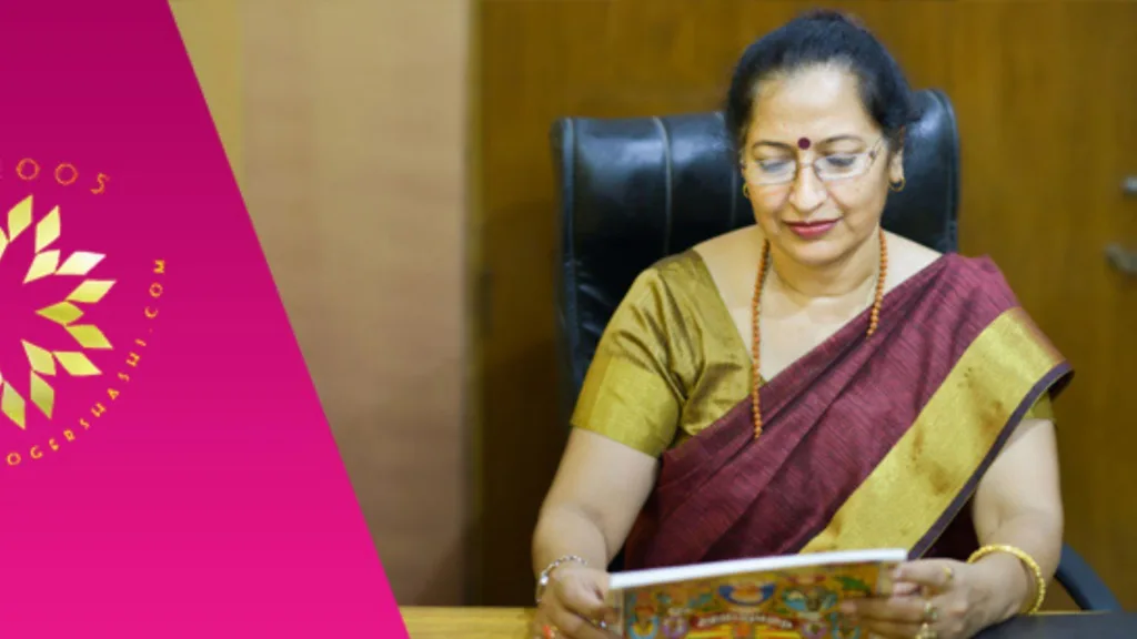 Astrologer Shashi wearing saree and sitting in her office. 